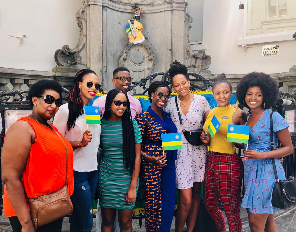 Rwandans living in Belgium pose by the Manneken Pis statue in Brussels after it was draped in Rwandan traditional gard. This was on July 4, to mark Rwandau2019s 25th liberation anniversary. / Courtesy