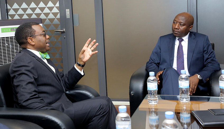 Prime Minister Edouard Ngirente chats with AfDB President Akinwumi Adesina (left) in Kigali yesterday. Ngirente said Rwanda has over 90 services online on Irembo platform and the country is now targetting universal digital literacy of young people by 2024 as well as leveraging innovation and technology to drive up the economy and reduce poverty. Courtesy. 