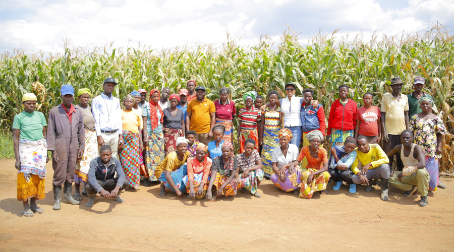 Bralirwa staff pose for a group photo with some of Ndego residents who work at Bramin farm. / JD Nsabimana