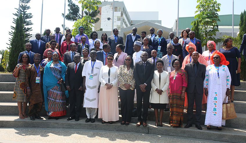 Speaker Donatille Mukabalisa (centre) in a group photo with officials from EAC and ECOWAS blocs, and representatives of civil society as well as land rights experts at the Parliamentary Buildings in Kimihurura yesterday. Courtesy.