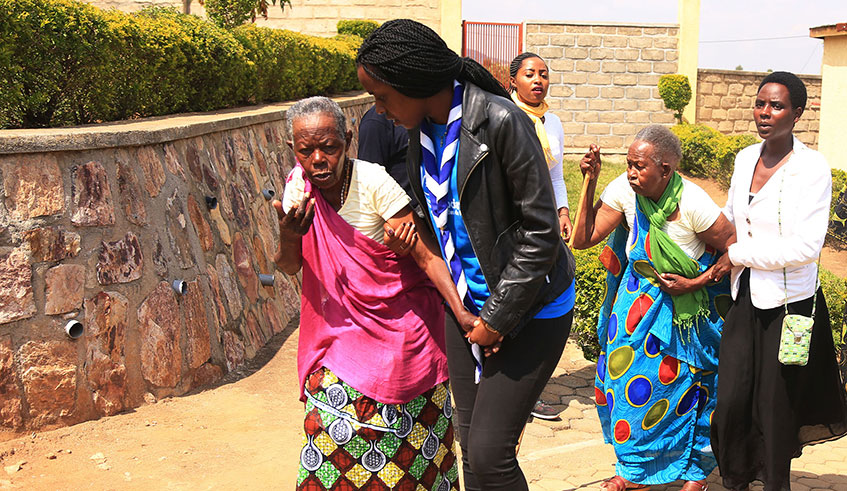 Youth offer support to elderly Genocide survivors at a function in Nyanza District earlier this year. Government has moved to increase the monthly stipend for disadvantaged Genocide survivors, such as the elderly, to help improve their welfare.  Sam Ngendahimana.