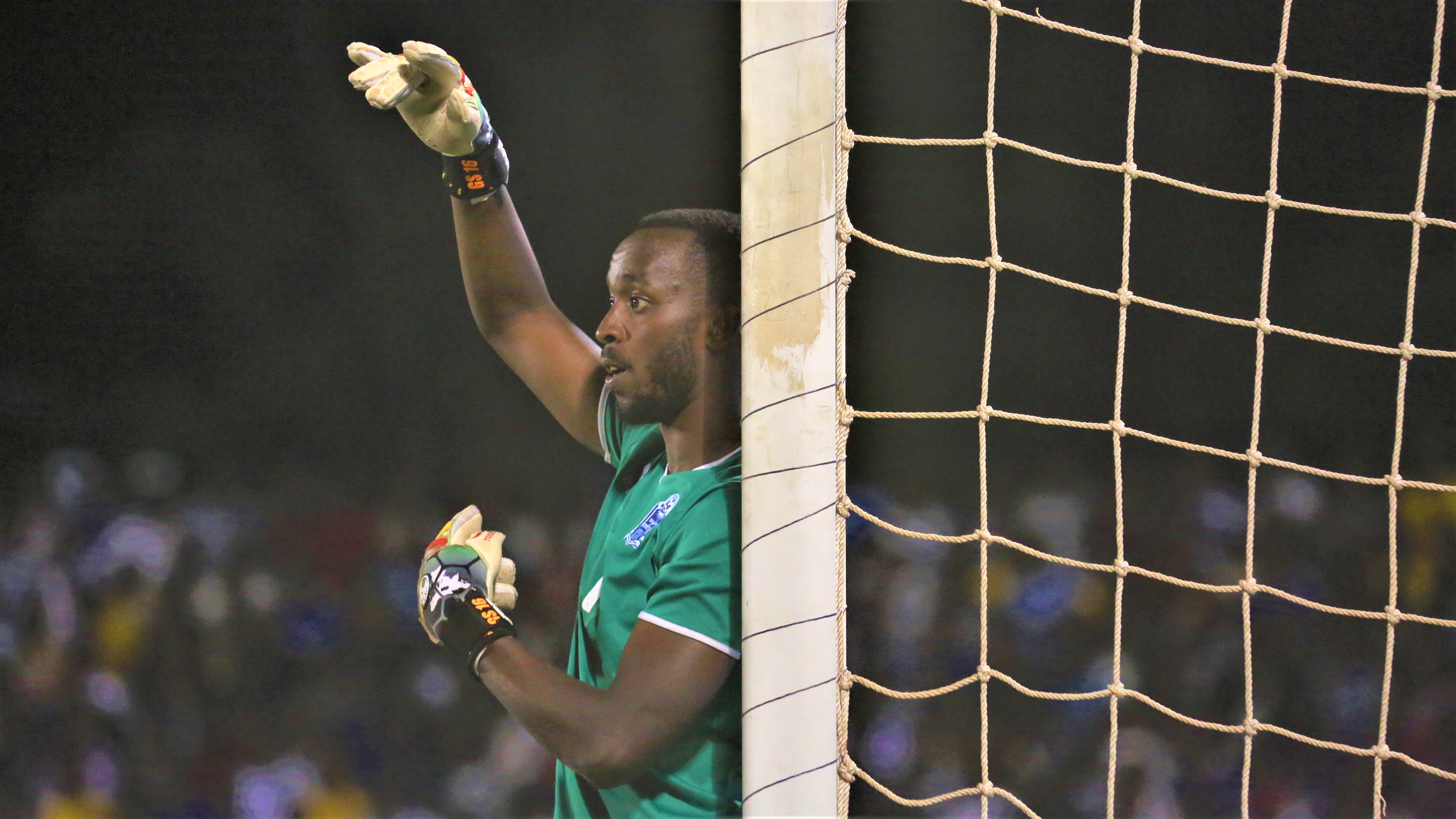 Rayon Sports goalkeeper Yves Kimenyi communicates with his defenders during their 2-1 defeat to KCCA at Kigali Stadium on Tuesday. / Sam Ngendahimama