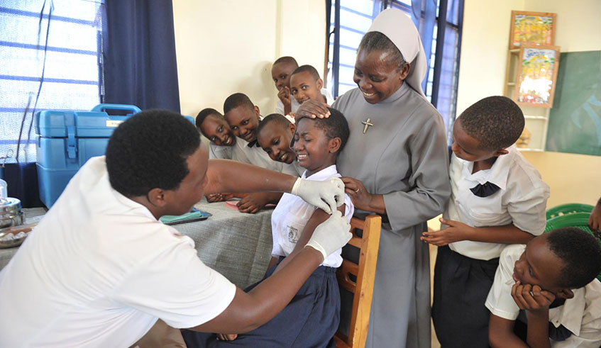 A girl receives HPV vaccine during a past vaccination campaign at a school in Kigali. Courtesy.