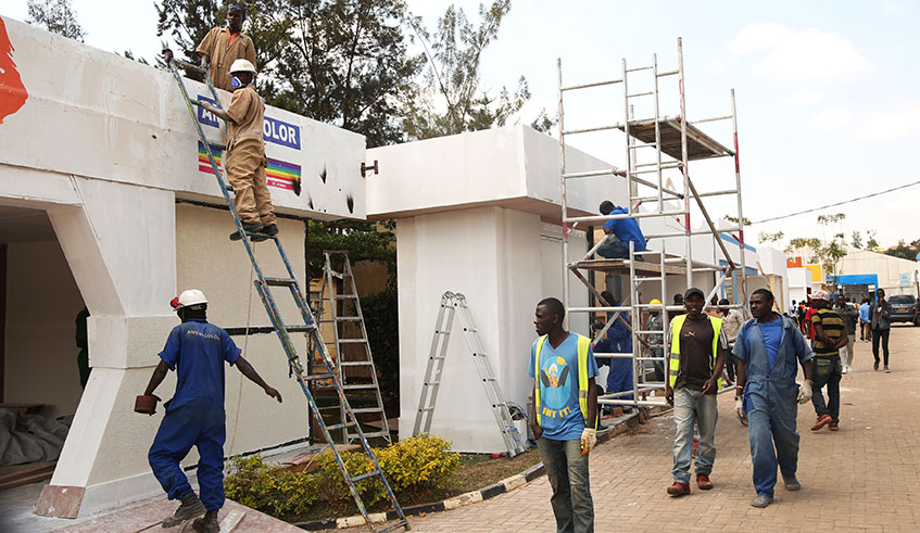 Exhibitors put up final touches to their stalls in preparation of the 22nd Rwanda International Trade Fair scheduled to open on July 22 at Gikondo showgrounds. Over 450 exhibitors from 25 countries are expected. Sam Ngendahimana.  