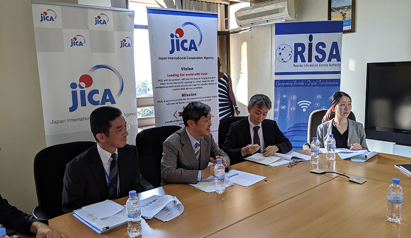 JICA President Shinichi Kitaoka (second left) together with his assistants holds a conversation with graduates of ABE Initiative at Telecom House in Kigali. (Photo by Julius Bizimungu). 