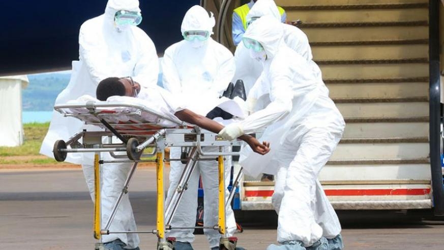 Medics demonstrate how to handle a suspected Ebola case during a past simulation exercise at the Rwanda Military Hospital Kanombe../ Net photo