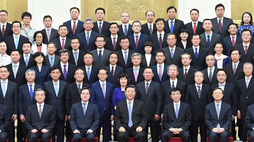 Chinese President Xi Jinping (C, front row) in a group photo with diplomats. 