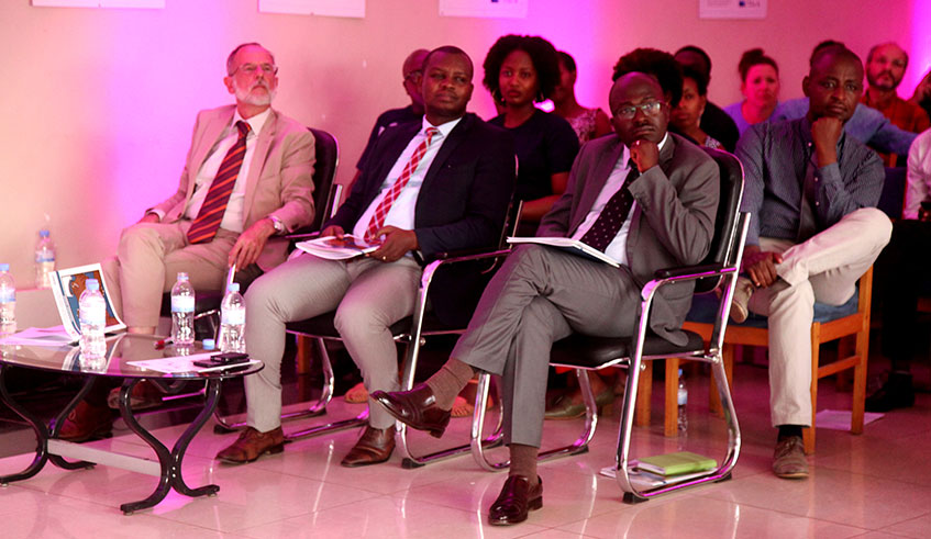 (L-R, front row): Amb. Ryelandt (left), the Belgian envoy to Rwanda, Aegis Trust Executive Director Fred Mutanguha and Iru00e9nu00e9e Ndayambaje of REB follow a presentation during the launch of Ubumuntu Digital Platform in Kigali on Thursday. Craish Bahizi.