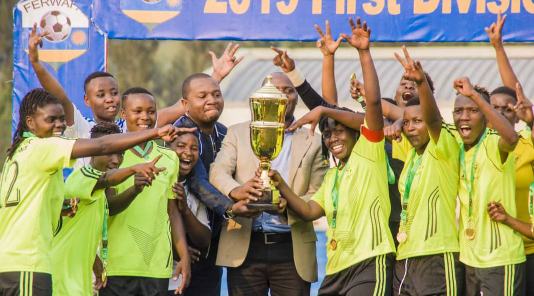 Scandinavia players and officials celebrate with the trophy after dethroning AS Kigali at Umuganda Stadium on Sunday. / Courtesy