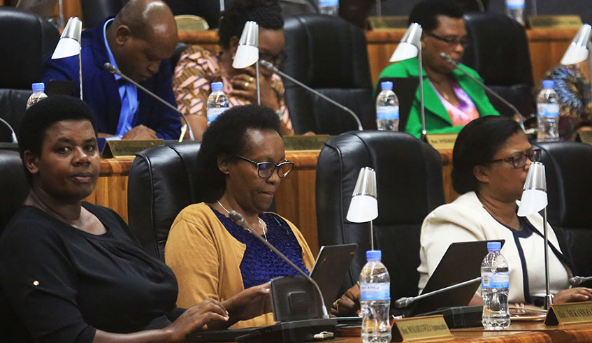 MPs follow the presentation of the report by Odette Uwamariya, the vice-president of the parliamentary Standing Committee on Economy and Trade at Parliamentary Buildings in Kimihurura yesterday. Sam Ngendahimana.