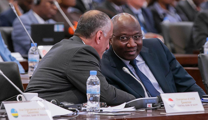 Prime Minister Edouard Ngirente interacts with Tarek Amer, Chairperson of the AACB and Governor Central Bank of Egypt at the conference in Kigali yesterday. Emmanuel Kwizera.