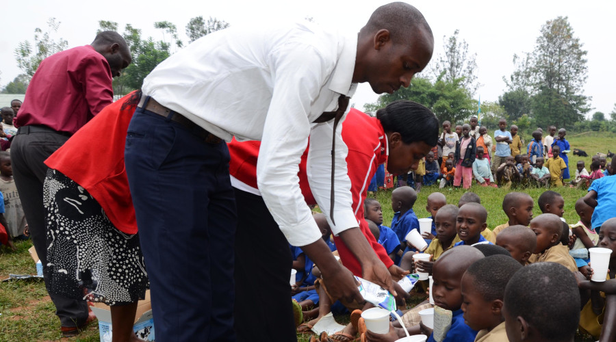 Teachers give fresh milk to school children at Kamabuye Sector in Bugesera District. / File