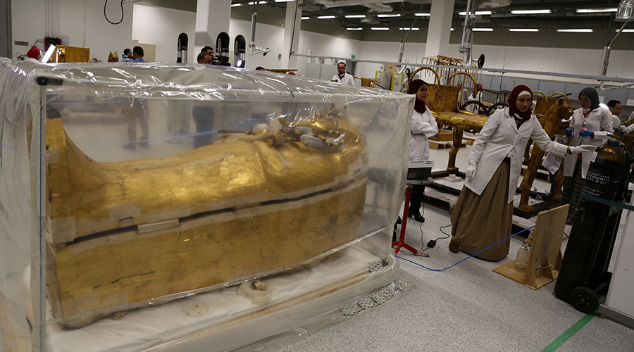 At an up-to-date conservation laboratory in the Grand Egyptian Museum, the large gilded coffin of famous ancient King Tutankhamun was placed inside a plastic incubator for sterilization in order to be later fully restored for the first time since it was discovered almost a century ago. / Xinhua/Ahmed Gomaa