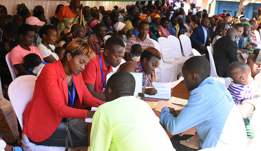 Residents during the registration of children in Kigarama Sector, Kirehe District on Monday. Jean de Dieu Nsabimana.
