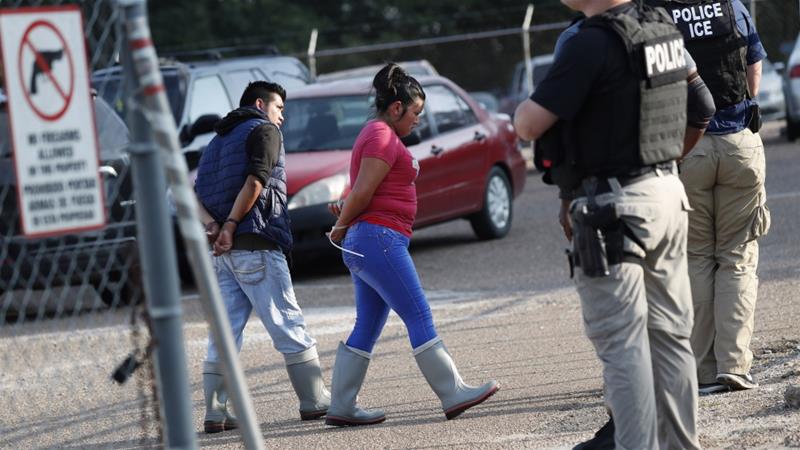 Those arrested were taken to a military hangar to be processed for immigration violations.