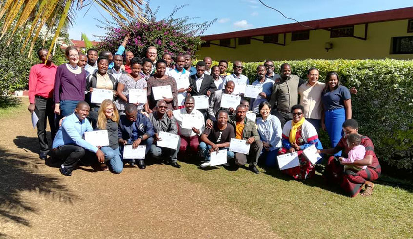 Participants pose for a group photo after getting certificates in MAP methodology, which uses arts, theatre and drama techniques to deliver quality lessons.