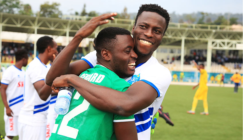 Rayon Sports striker, Michel Sarpong (R) and goalkeeper Gerard Bikorimana celebrate a recent win. Sam Ngendahimana