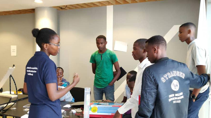 Nancy teaching and demonstrating concepts on Renewable Energy (Solar power, Wind power, Hydrogen power, etc) to Sci-Touche 2019 participants at the Kigali Public Library. Courtesy.