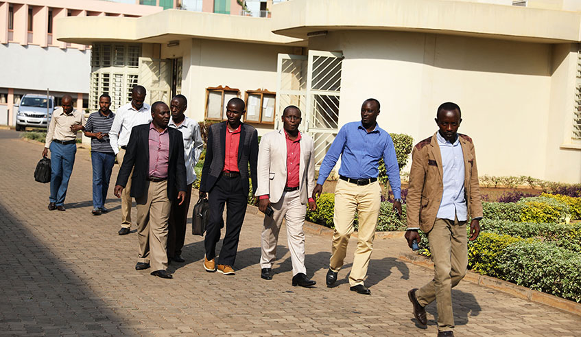 The nine Rwandans who were illegally deported from Uganda making their way to the Sub-Registry of the East African Court of Justice near the Supreme Court yesterday. This is the second group to petition the regional court over the mistreatment they suffered at the hands of the Ugandan security operatives. Courtesy.