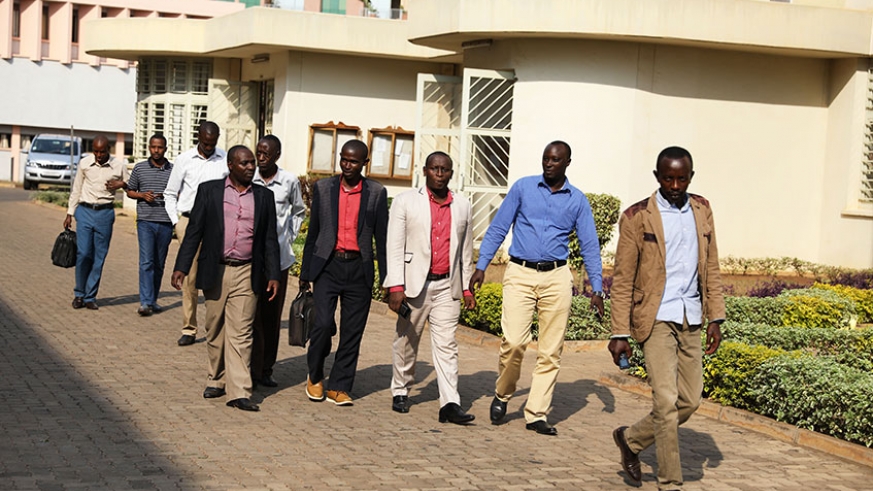 The nine Rwandans who were illegally deported from Uganda making their way to the Sub-Registry of the East African Court of Justice near the Supreme Court yesterday. This is the second group to petition the regional court over the mistreatment they suffered at the hands of the Ugandan security operatives. / Courtesy