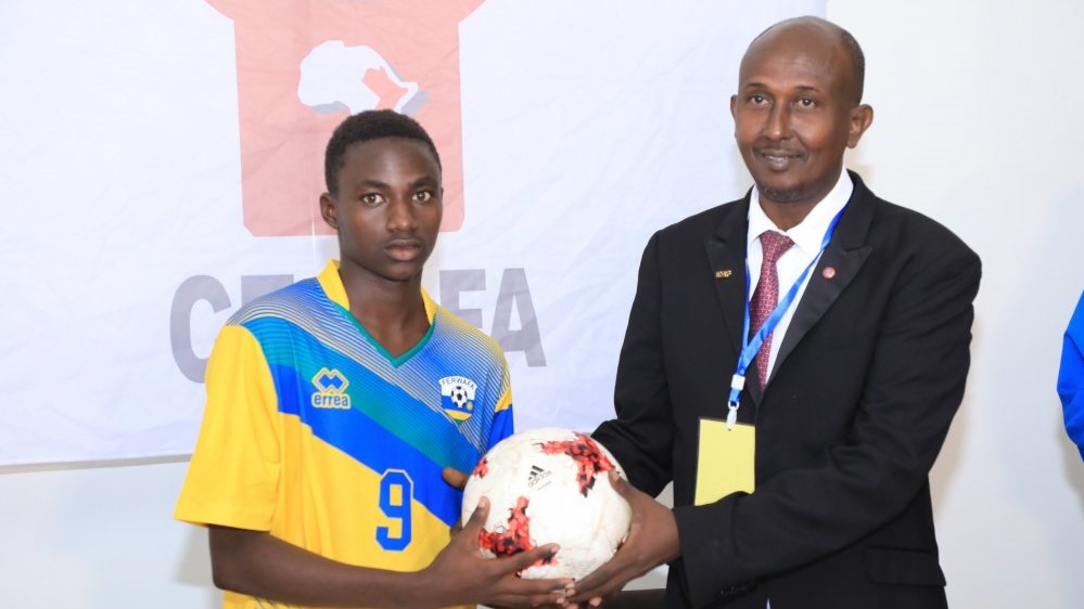 Eric Irahamye receives the match ball after scoring a hat-trick against South Sudan at the ongoing Cecafa U15 Challenge on Saturday. Courtesy