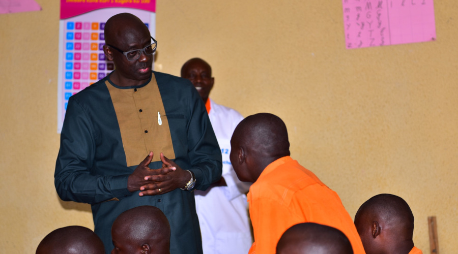 Minister Busingye talking to a student inmate in Nyagatare Juvenile Prison. (Photo by Jean de Dieu Nsabimana)