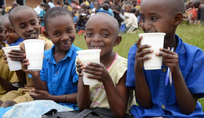 Pupils in Bugesera District being served milk. Sam Ngendahimana.