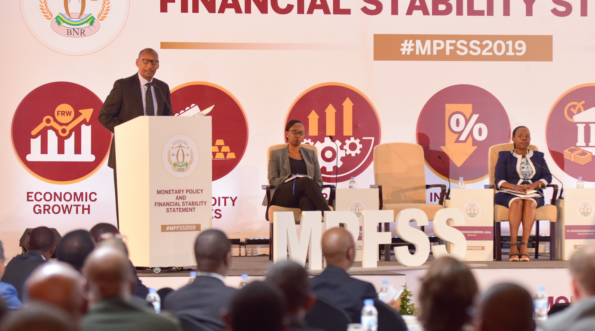 Central Bank Governor John Rwangombwa (left) speaks at the meeting, as Peace Uwase Masozera, Executive Director Financial Stability, and Vice-Governor Monique Nsanzabaganwa look on in Kigali yesterday. / Courtesy