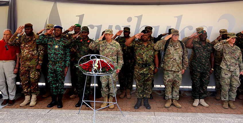 Officers from different countries pay homage to victims at Kigali Genocide Memorial on Friday. The delegation consisted 1200 troops from 26 countries that are taking part in Exercise Shared Accord 2019 at the RDF Combat Training Centre in Gabiro. Craish Bahizi.