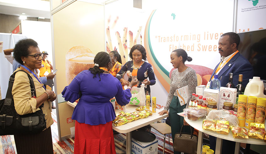 Delegates during a visit to the exhibition stand of Entreprise Urwibutso of local agri-businessman Gu00e9rard Sina at Kigali Marriott Hotel on August 26. The exhibition has been organised on the sidelines of the 11th African Potato Association (APA) that is underway in Kigali.  Emmanuel Kwizera.
