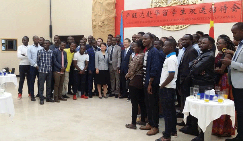 Beneficiaries of the scholarship programme in a group photo with the Chinese Ambassador to Rwanda. Courtesy.