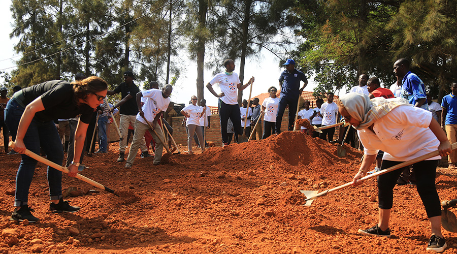Members of Parliament, representatives of the United Nations Population Fund (UNFPA), Visit Rwanda team and other Government officials took part in Umuganda. / Sam Ngendahimana