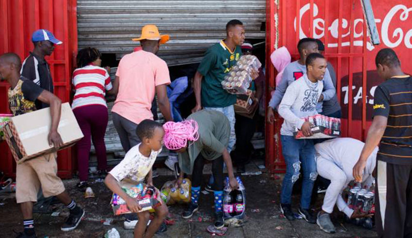 South Africans seen looting shops that belong to foreigners. No Rwandan has died or been threatened in the latest wave of 'anti-foreigner' violence in Johannesburg.