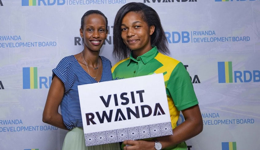 Uwera, 23, played football before switching to cricket in 2012. She is seen here with Belise Kariza (left), Chief Tourism Officer of the Rwanda Development Board. Courtesy Photos.