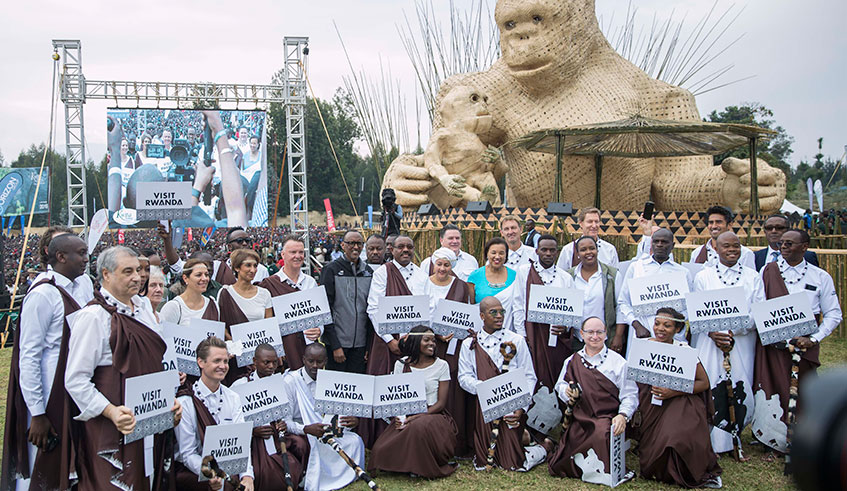 President Kagame in a group photo with the namers of baby gorillas at the 15th edition of the annual Kwita Izina ceremony at the foot of the Volcanoes National Park in Musanze District yesterday. The President thanked Rwandans for their role in conserving the environment. Village Urugwiro.
