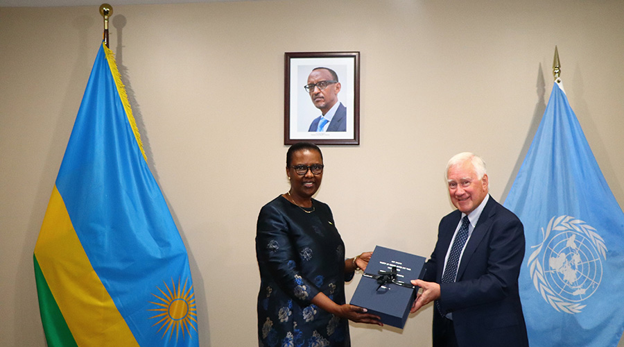 New Zealandu2019s former envoy to the UN, Amb. Colin Keating hands over diplomatic archives to Rwanda's Permanent Representative to the UN, Valentine Rugwabiza. / Courtesy