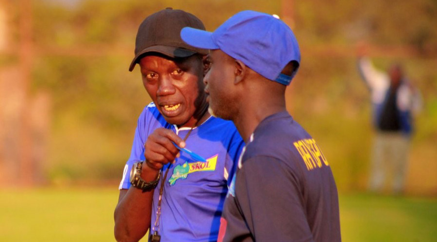 Rayon Sports interim coach Jean-Baptiste Kayiranga speaks to his assistant, Alain Kirasa, during a past training session at the clubu2019s training base in Nzove, Nyarugenge District. / Courtesy