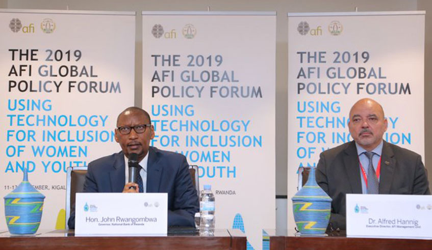 National Bank of Rwanda Governor John Rwangombwa (left), and AFI Executive Director Dr Alfred Hannig addressing the media yesterday. Courtesy
