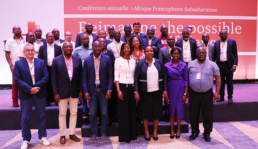 Board members and staff of PwC pose for a group photo in Kigali yesterday. Photos by Sam Ngendahimana.