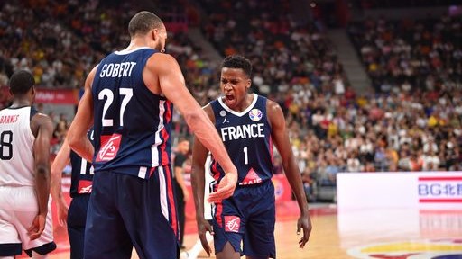 Rwanda-born France international Frank Ntilikina (#1) and Rudy Gobert (#27) celebrate after beating Team U.S.A at the Dongguan Basketball Center on Wednesday. Net