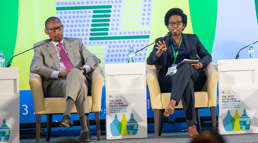 Bank of Kigali Group chief executive Diane Karusisi (right) speaks on a panel during the 11th Alliance for Financial Inclusion Global Policy Forum 2019 in Kigali on September 12, 2019. Looking on is National Bank of Rwanda governor John Rwangombwa. / Emmanuel Kwizera