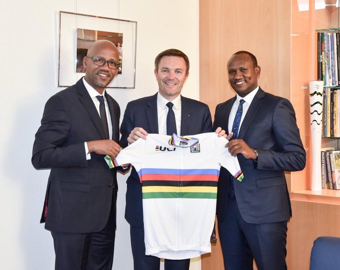 Rwanda cycling federation's President Aimable Bayingana (L) and PS at the Ministry for Sports John Ntigengwa (R) after formally submitting the bid to UCI President David Lappartient in Switzerland on Wednesday. / Courtesy