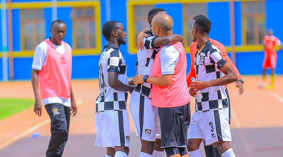 APR FC coach, Mohammed Adil and some of his players. / Courtesy