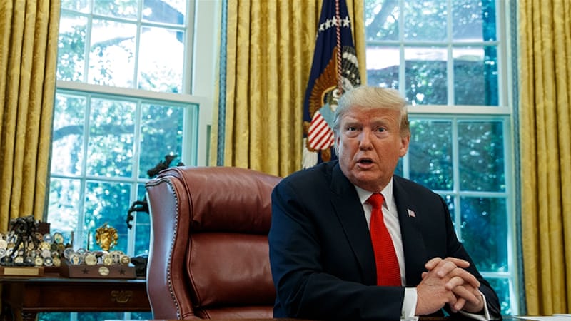 Trump speaks to reporters in the Oval Office of the White House. / Reuters