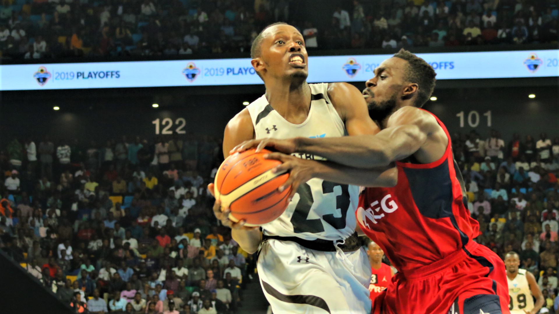 Steven Hagumintwari (L) posted a game-high 17 points to Power Patriots to 78-60 win over REG in Game 6 at Kigali Arena on Friday. Shooting guard Beleck Bell (R) led REG with 13 points on the night. /Saddam Mihigo