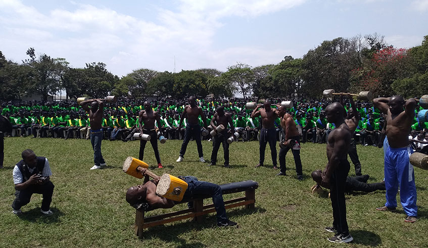 Some of the youths lift weights to showcase their fitness as part of activities lined up on graduation day at Iwawa Vocational Training and Rehabilitation Centre in Rutsiro District on Friday. Ru00e9gis Umurengezi.