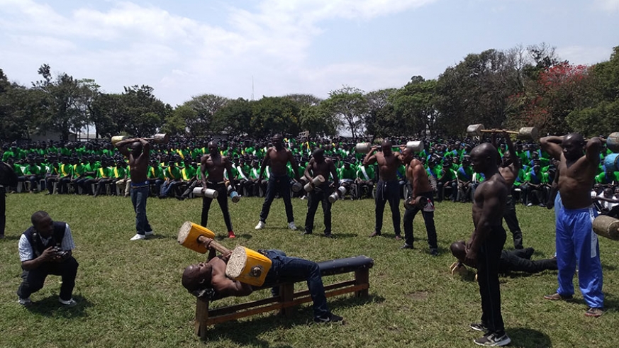 Some of the youths lift weights to showcase their fitness as part of activities lined up on graduation day at Iwawa Vocational Training and Rehabilitation Centre in Rutsiro District on Friday. / Ru00e9gis Umurengezi