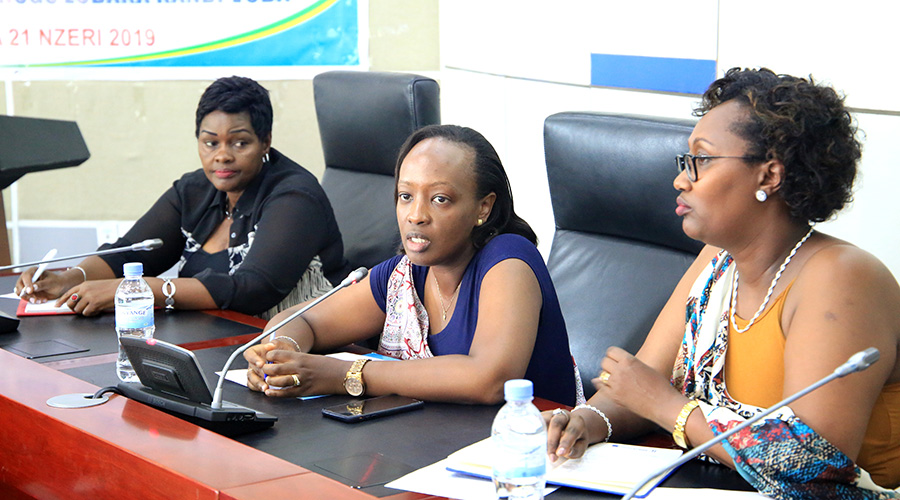 Nadine Umutoni, the Vice-Mayor in Charge of Social-Economic Affairs in the City of Kigali (centre), speaks during the meeting while as Aurore Umuhoza, Coordinator of the National Women Council in the city of Kigali (right) looks on. On the left is Allen Atwiine, an official with the National Women Council. The council has vowed to put up a fresh fight to counter the rising numbers of divorces in the country. / Craish Bahizi