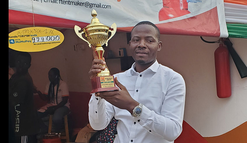 Fiacre Nemeyimana with one of the trophies he won from an exhibition. Courtesy photos.