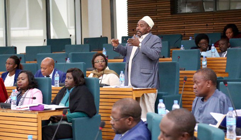 EALA members during a past plenary session in Arusha, Tanzania. The regional parliament is set to study a petition by the East African Civil Society Organisation Forum that aims to sue member states that default on their financial obligations. Courtesy.